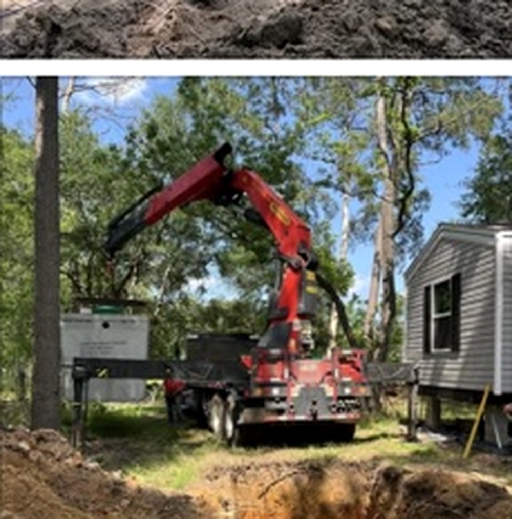 Creekline crew setting a new septic tank